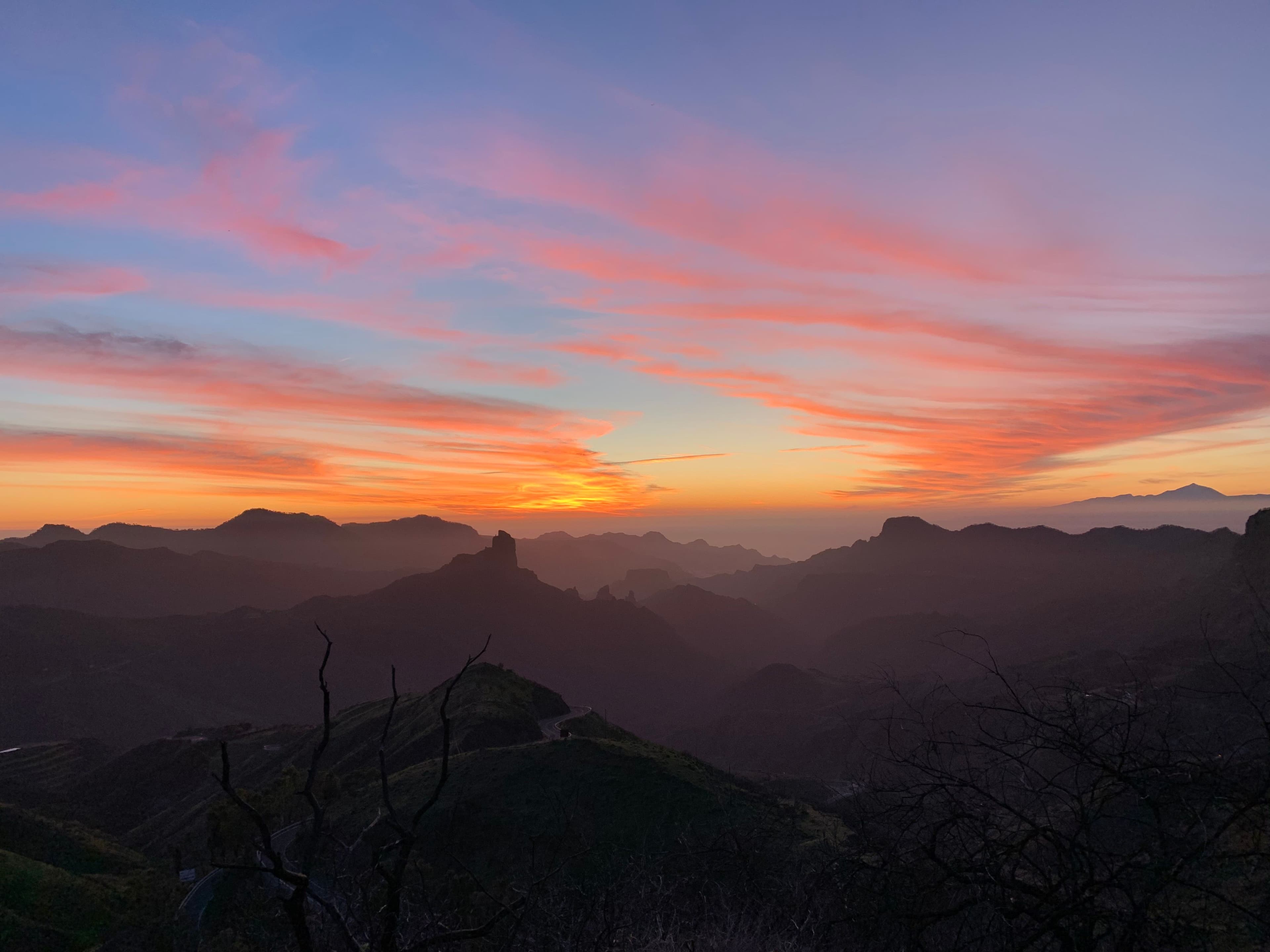 Layered mountain ridges across the interior of Gran Canaria at sunset
