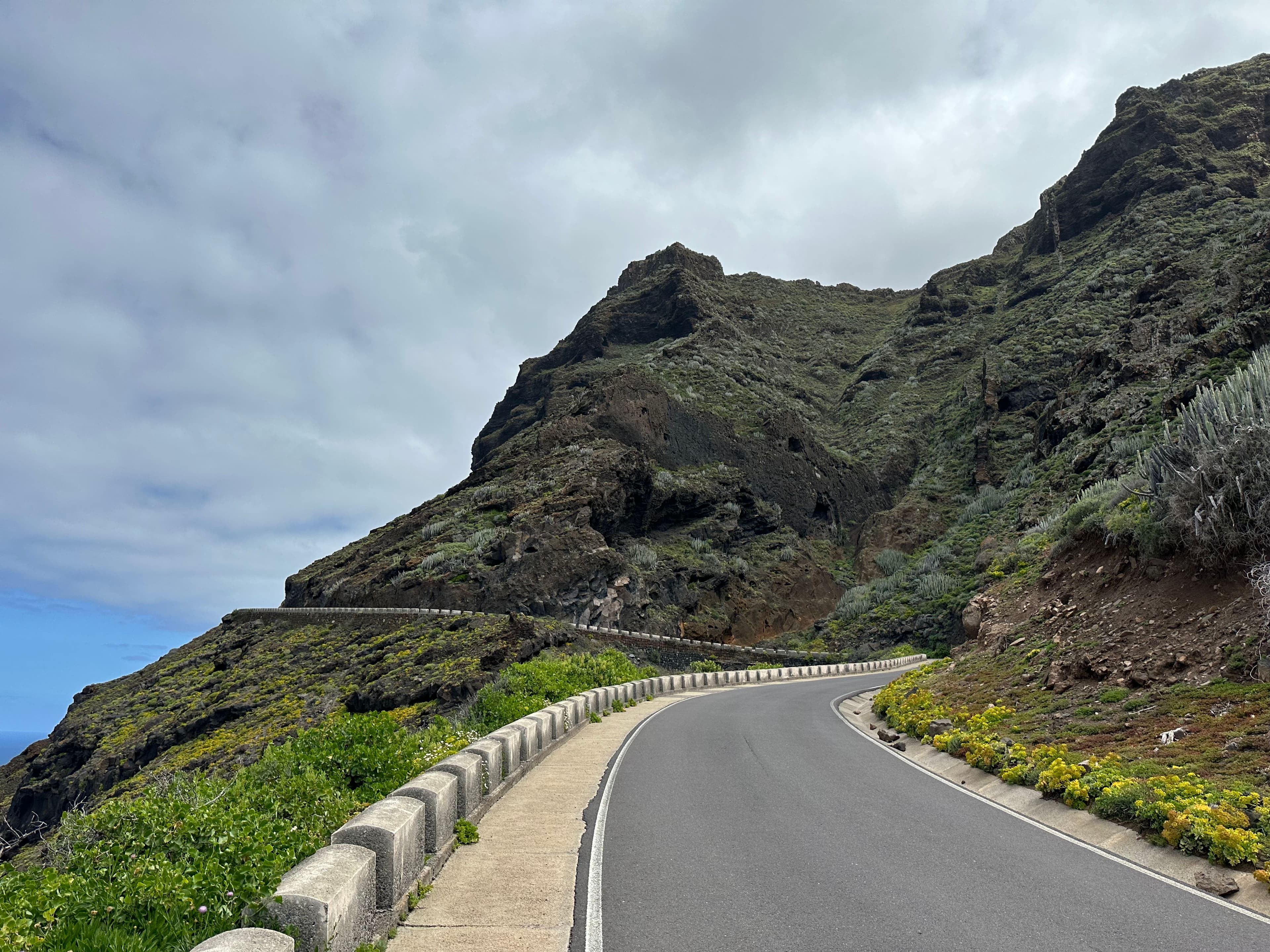 A coastal road running beneath Gran Canaria's cliffs