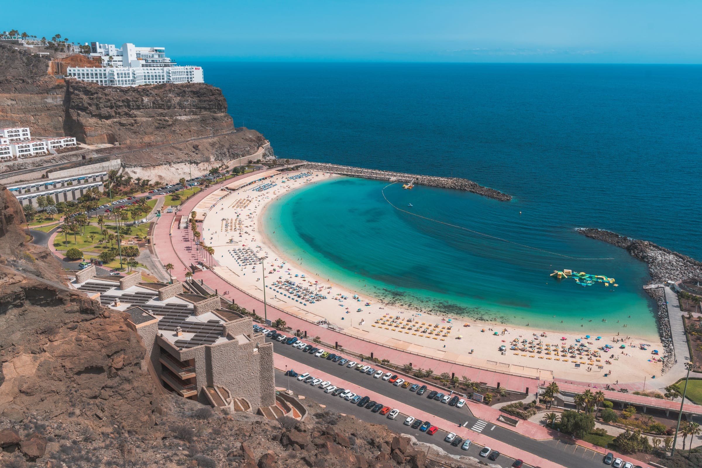 Playa de Amadores from the air, a sheltered curve of sand next to Puerto Rico on the southwest coast